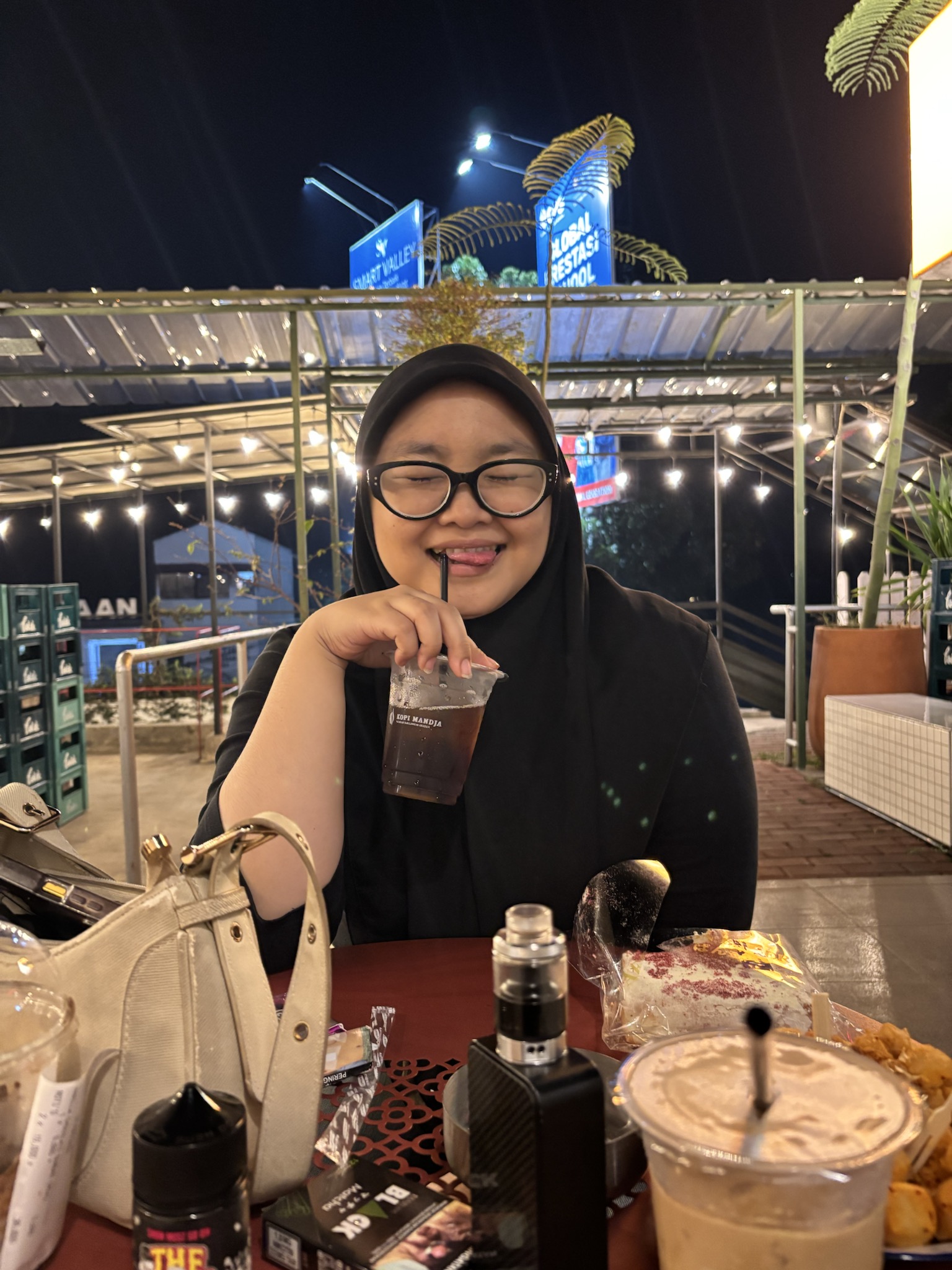 Iced drink, playful eyes, my favorite view.