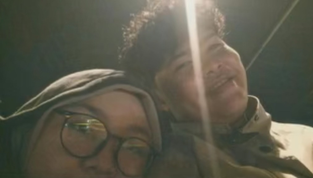 Close faces. Soft night. One bright light.